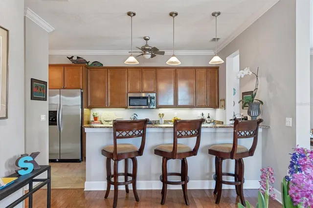 a kitchen with stainless steel appliances granite countertop a stove and a sink