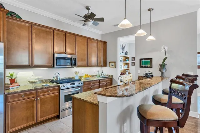 a living room with furniture a rug and a flat screen tv