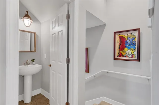 a spacious bathroom with a sink double vanity and a mirror