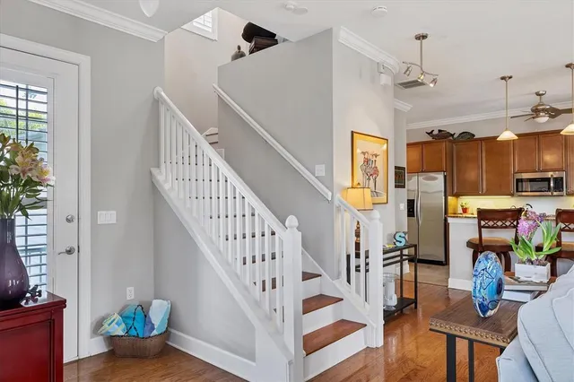 a bedroom with two beds and a potted plant