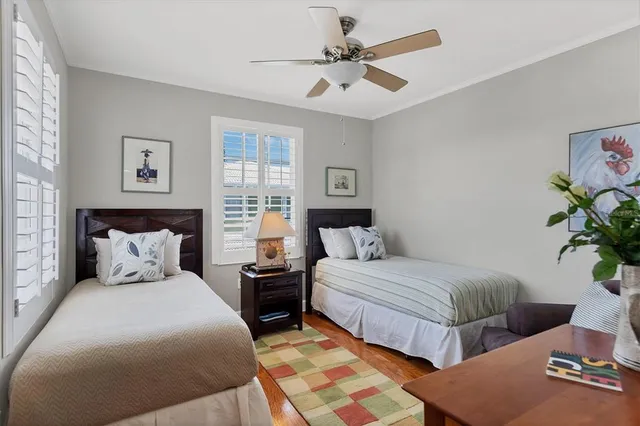 an aerial view of a house with a yard and lake view