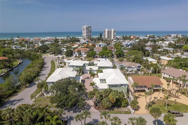 a view of a hallway with paintings on the wall