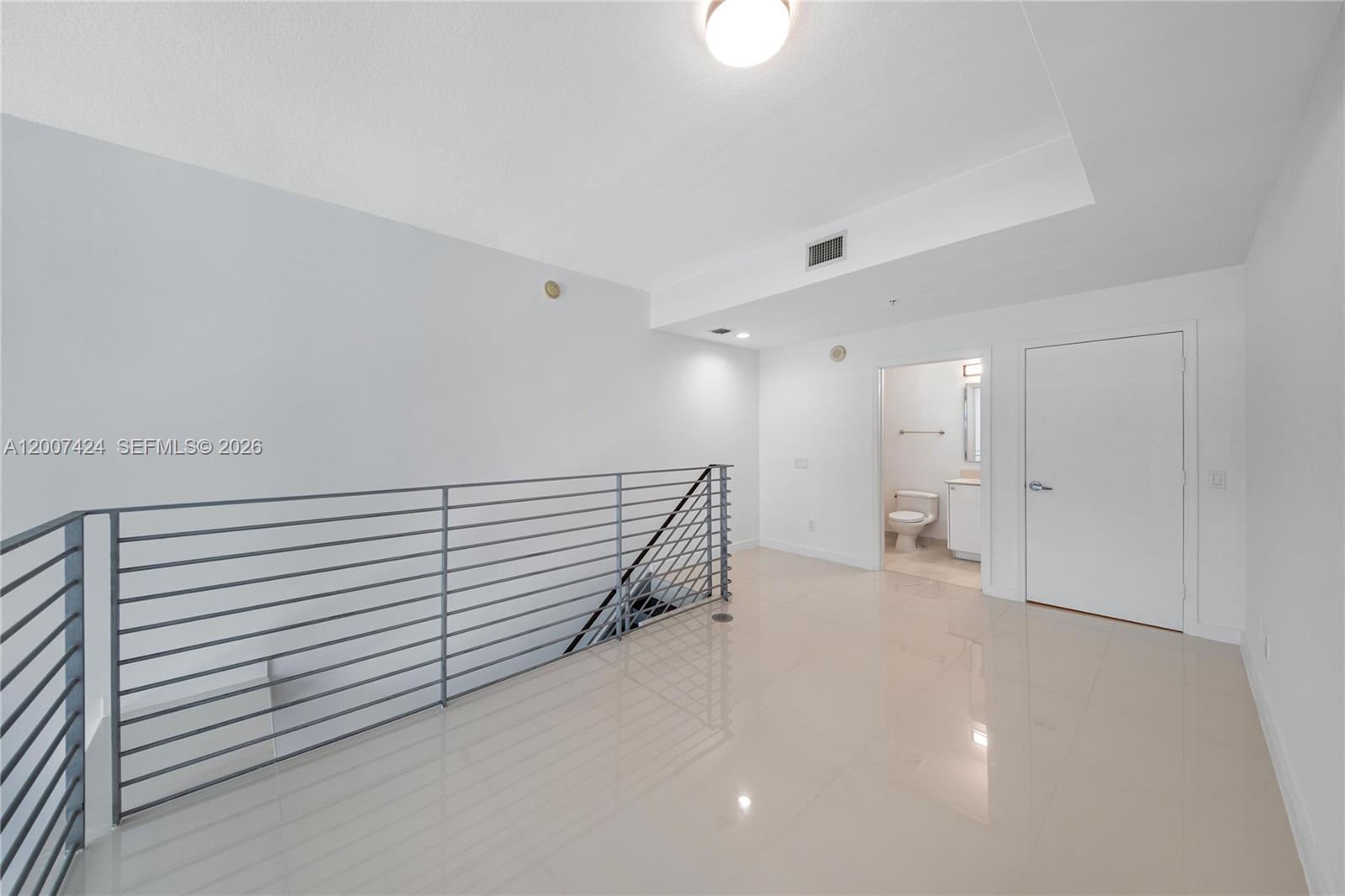 60 Southwest 13th Street, Unit 2420 Miami, FL 33130 - Photo 15 of 30 a view of a livingroom with a staircase