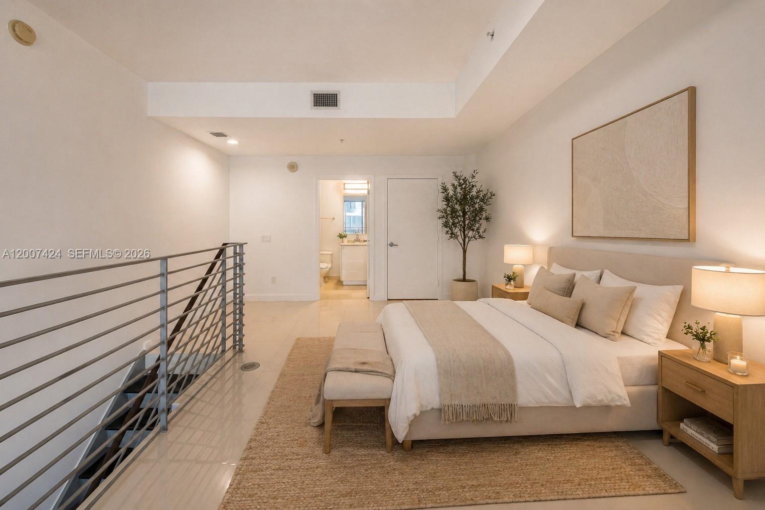 60 Southwest 13th Street, Unit 2420 Miami, FL 33130 - Photo 16 of 30 a spacious bedroom with a bed and a chandelier