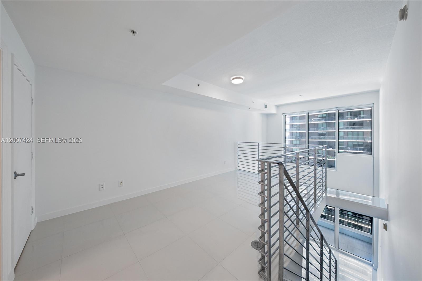 60 Southwest 13th Street, Unit 2420 Miami, FL 33130 - Photo 19 of 30 a view of a room with racks on the wall