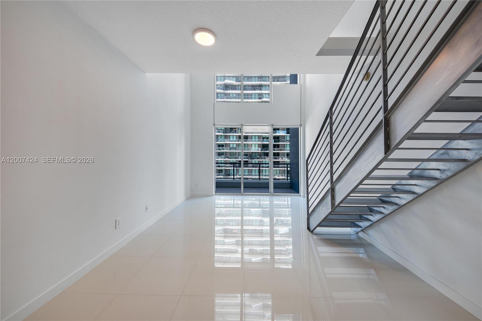 60 Southwest 13th Street, Unit 2420 Miami, FL 33130 - Photo 2 of 30 a view of entryway and hall with wooden floor