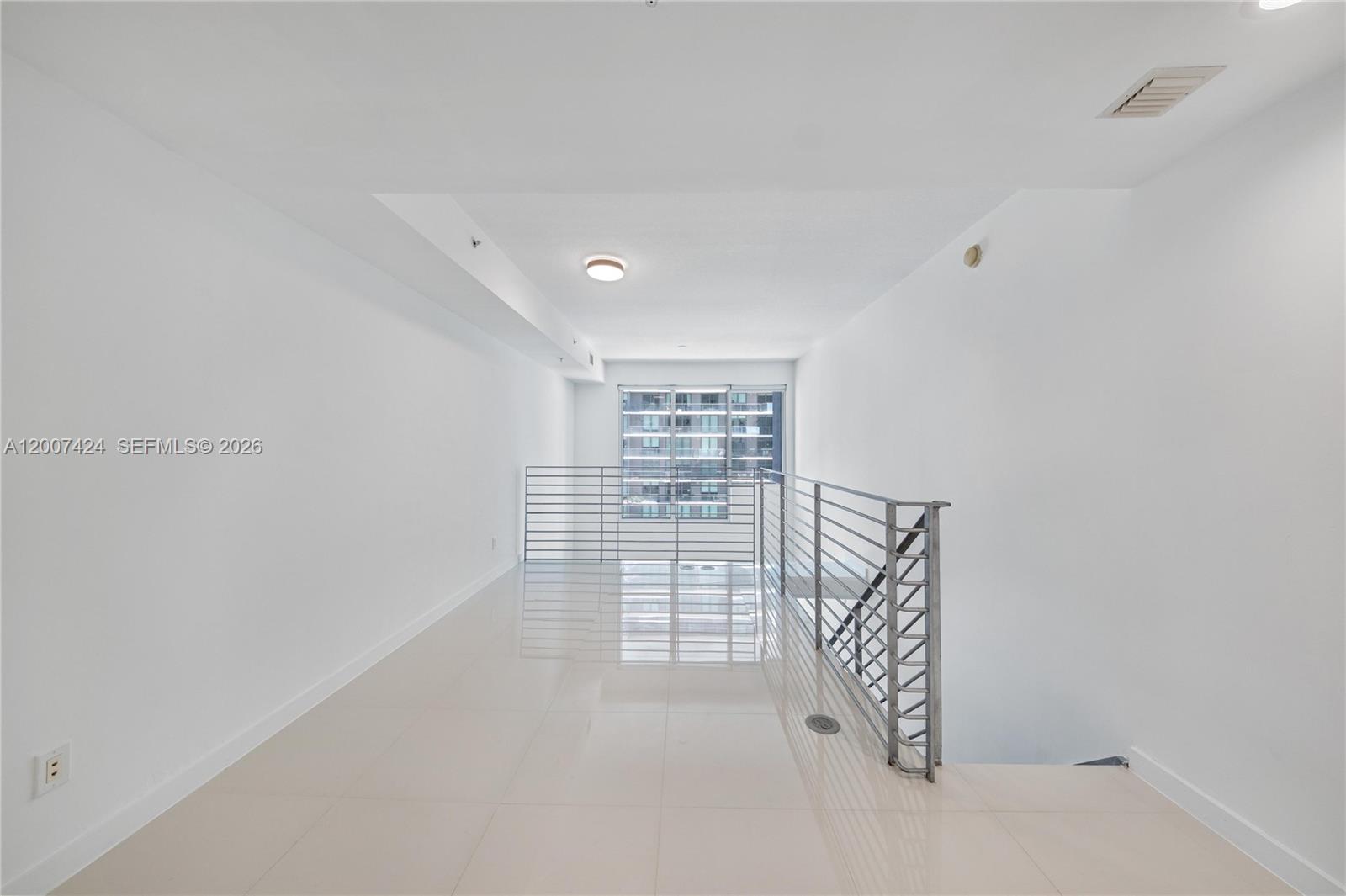 60 Southwest 13th Street, Unit 2420 Miami, FL 33130 - Photo 21 of 30 a view of livingroom with stairs