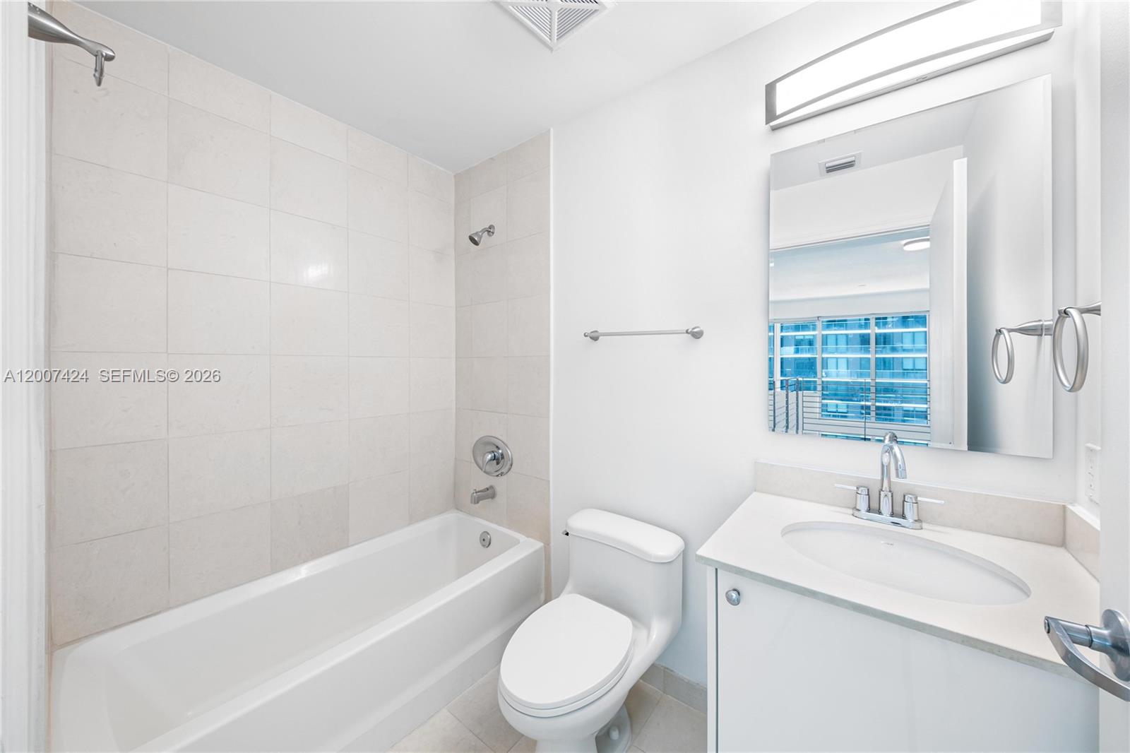 60 Southwest 13th Street, Unit 2420 Miami, FL 33130 - Photo 23 of 30 a bathroom with a sink toilet and bathtub