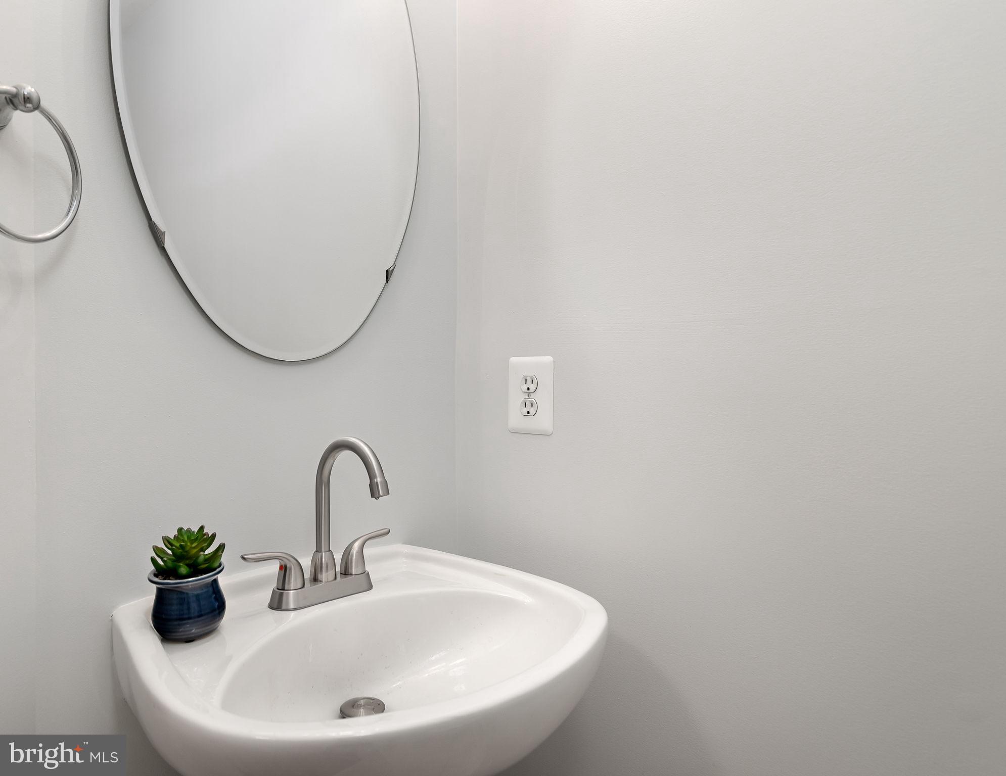 43002 Center Street Chantilly, VA 20152 - Photo 12 of 35 a bathroom with a sink and mirror