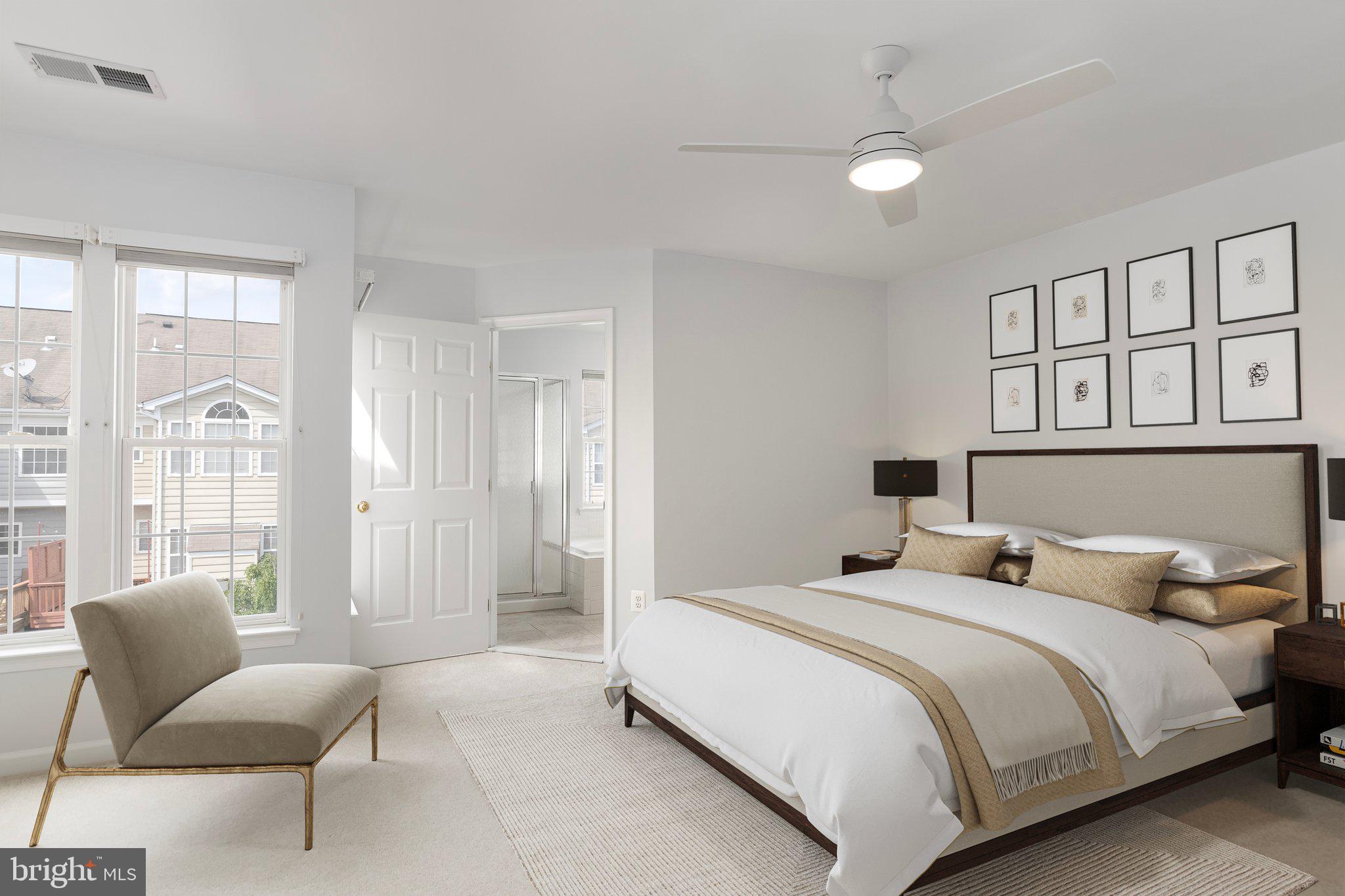 43002 Center Street Chantilly, VA 20152 - Photo 13 of 35 a bedroom with a balcony a bed and a couch