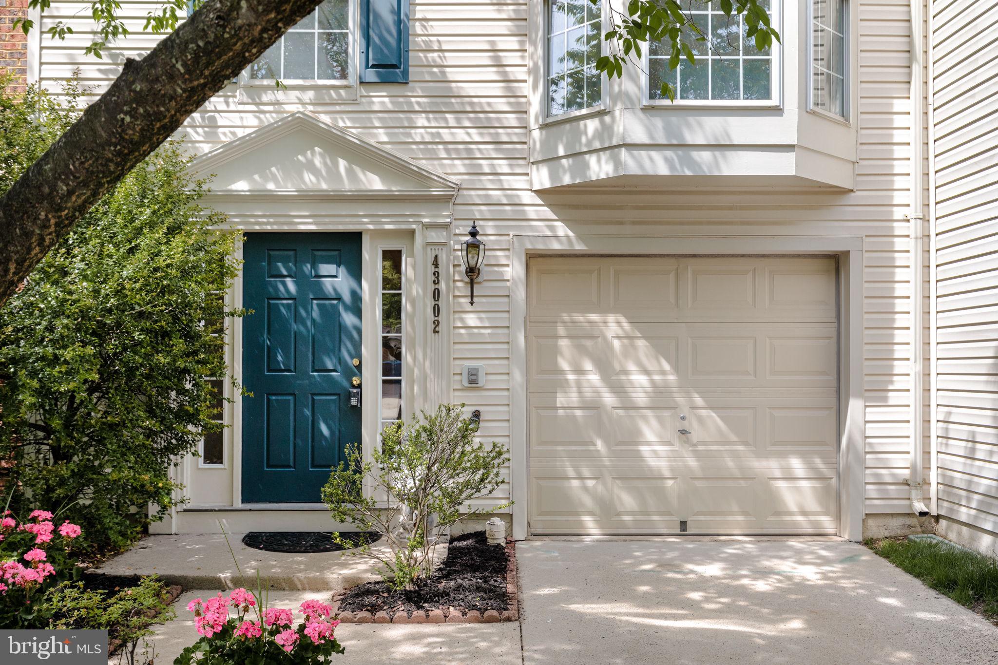 43002 Center Street Chantilly, VA 20152 - Photo 2 of 35 a front view of a house with a yard