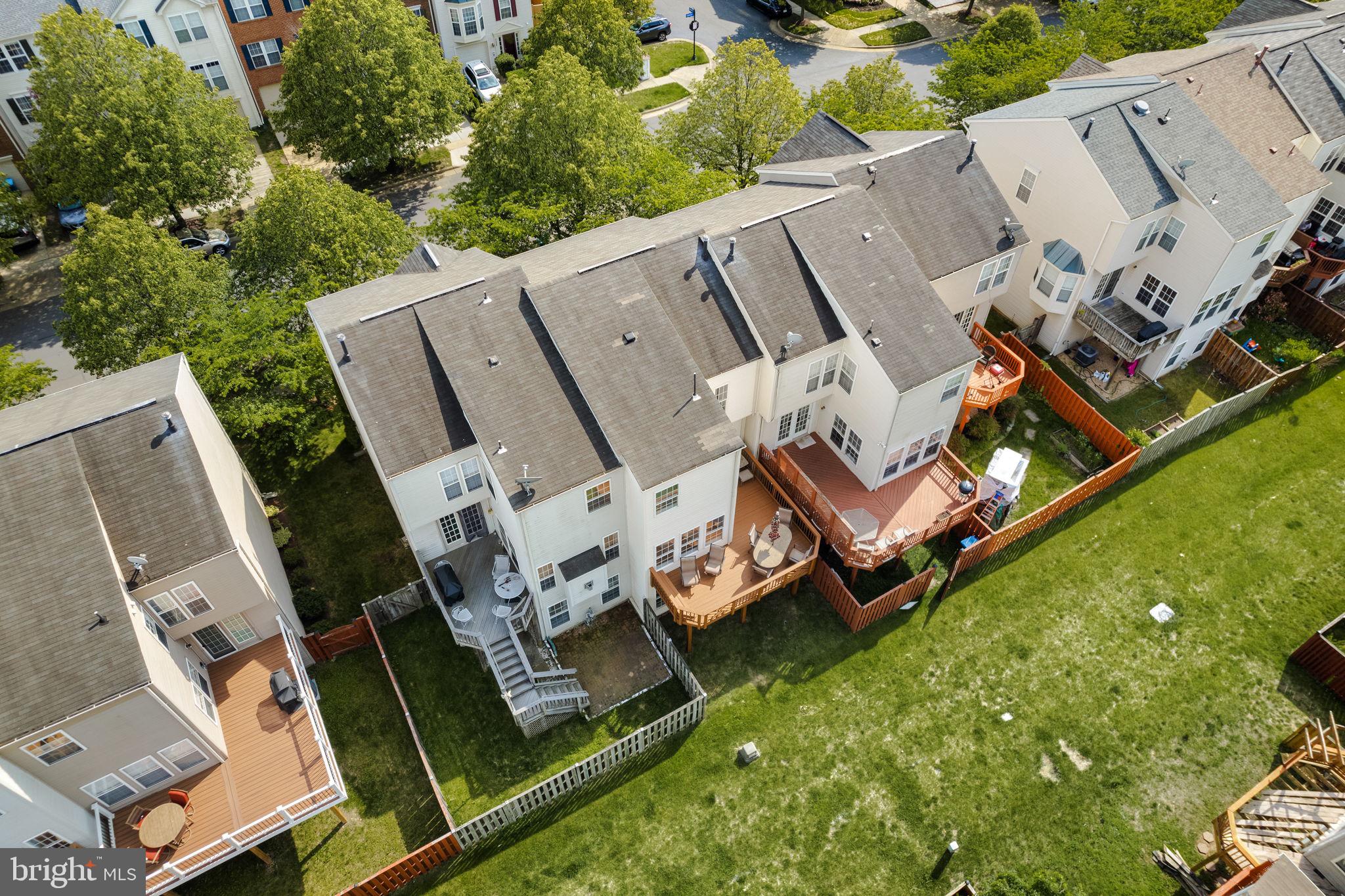 43002 Center Street Chantilly, VA 20152 - Photo 22 of 35 an aerial view of a house with a big yard and large trees
