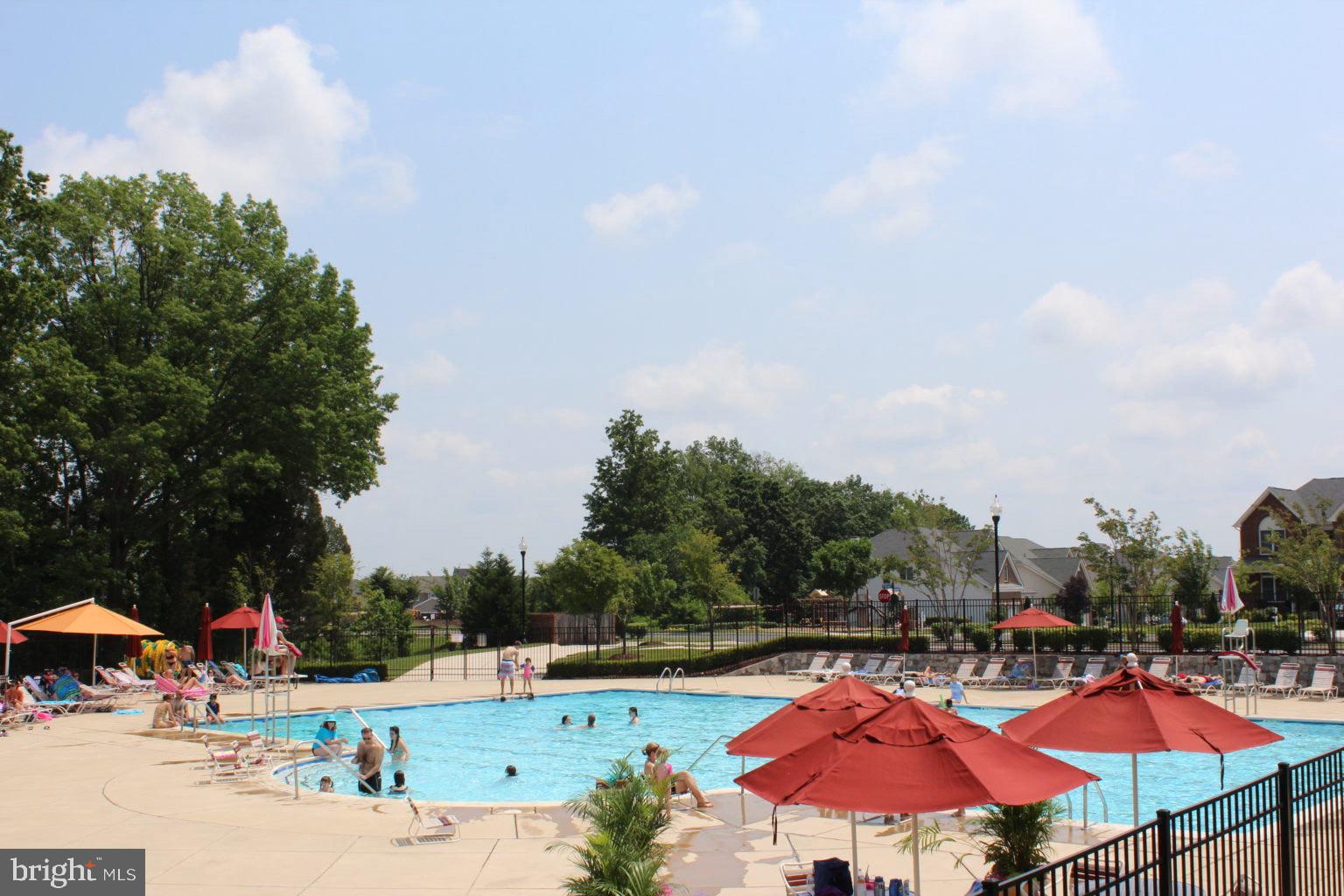 43002 Center Street Chantilly, VA 20152 - Photo 29 of 35 an outdoor space with patio lots of white furniture and fire pit