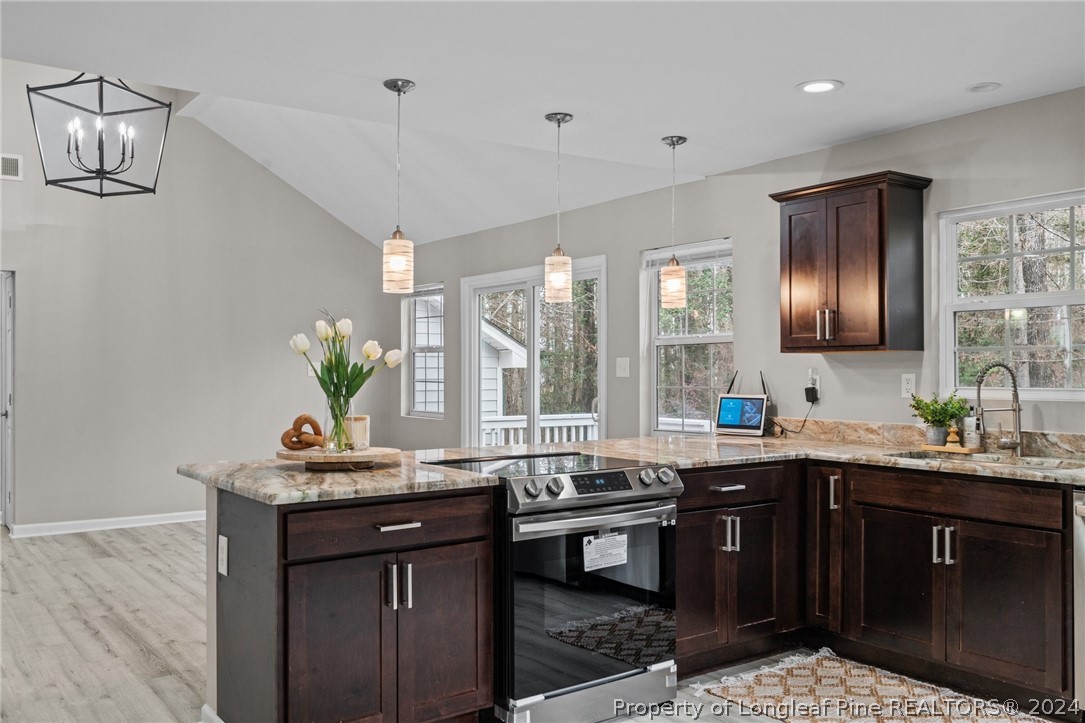 7039 Pine Road Sanford, NC 27332 - Photo 12 of 35 a kitchen with a sink and stove