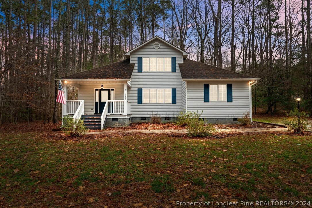 7039 Pine Road Sanford, NC 27332 - Photo 2 of 35 front view of a house with a yard