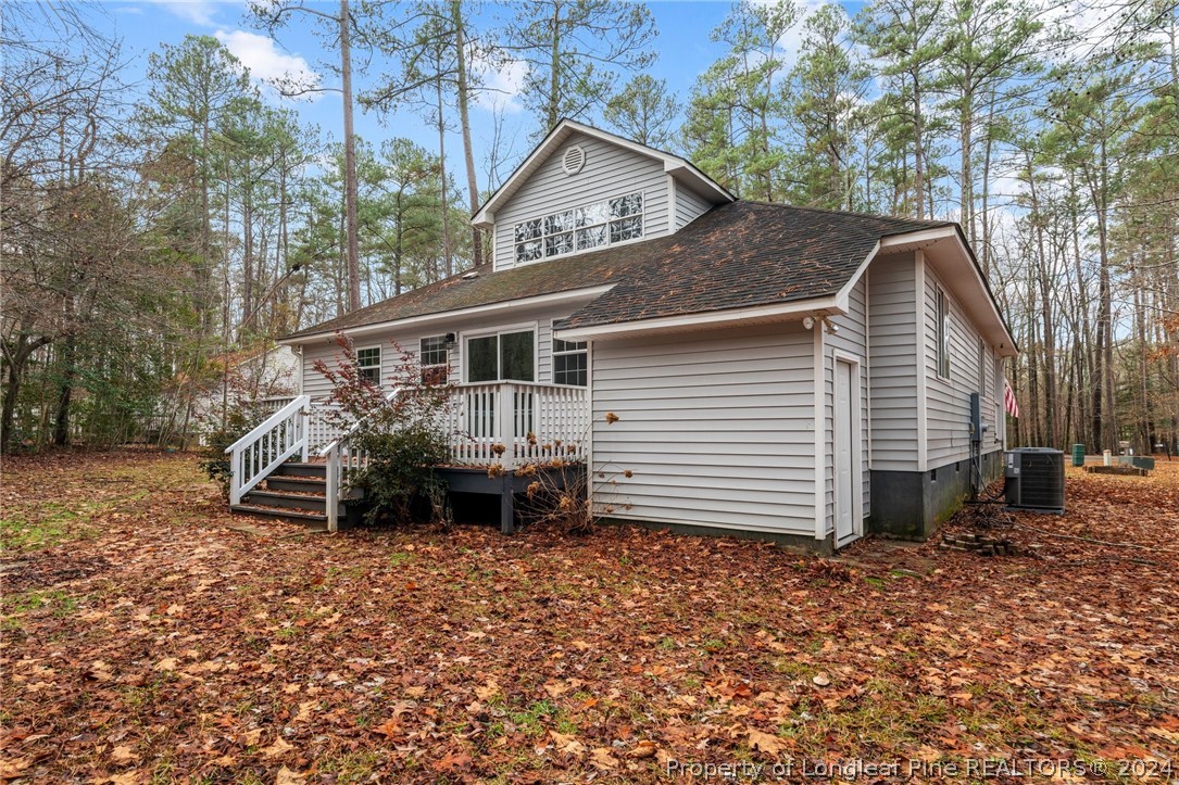 7039 Pine Road Sanford, NC 27332 - Photo 32 of 35 a view of a house with a yard and sitting area