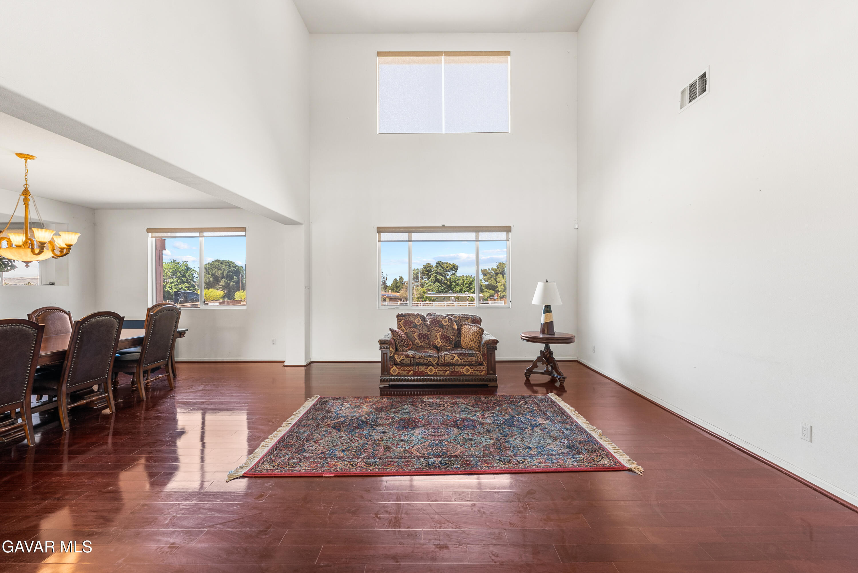 658 Lago Lindo Road Palmdale, CA 93550 - Photo 13 of 91 a living room with furniture and a rug