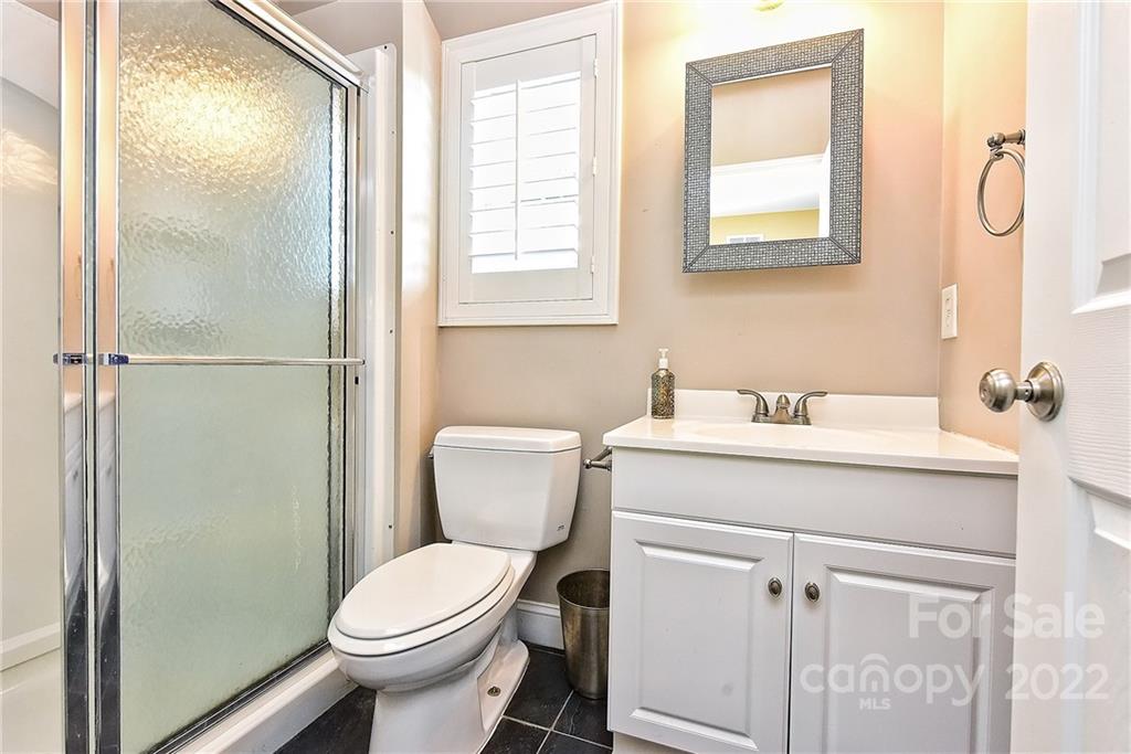 7115 Ramsgate Road Charlotte, NC 28270 - Photo 35 of 39 a white toilet sitting next to a bathroom sink