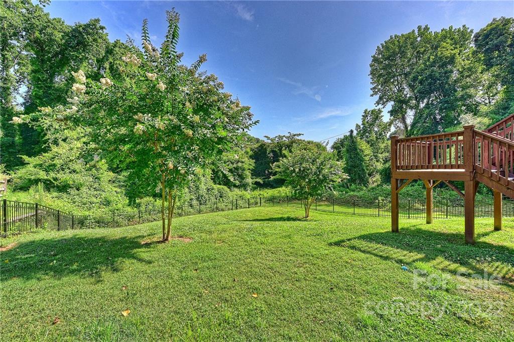 7115 Ramsgate Road Charlotte, NC 28270 - Photo 38 of 39 a view of a house with a backyard
