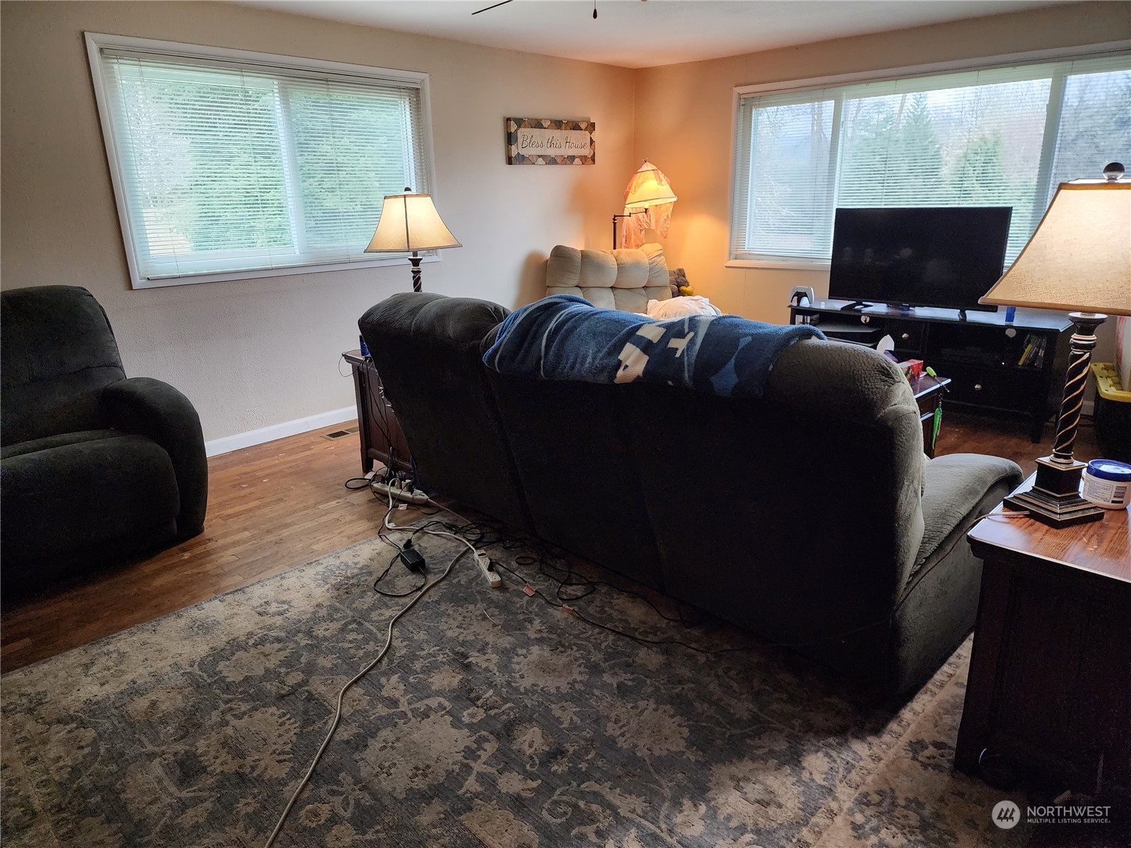 447 Independence Road Rochester, WA 98579 - Photo 11 of 35 a living room with furniture a window and a flat screen tv