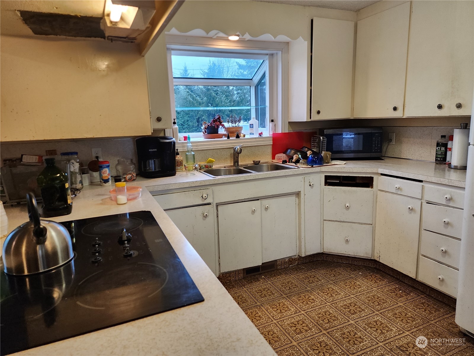 447 Independence Road Rochester, WA 98579 - Photo 6 of 35 a kitchen with a sink and cabinets