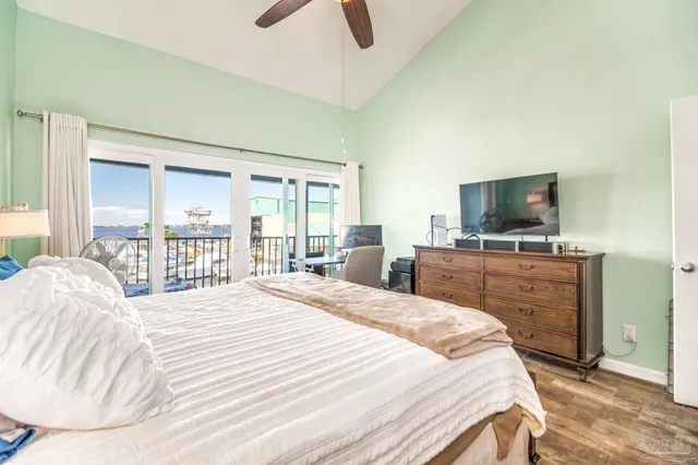 a bedroom with a bed and a flat screen tv