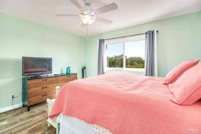 a bed room with a bed and a tv