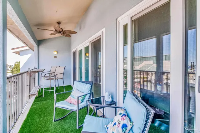 a view of a porch with furniture and garden