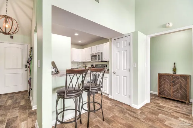 a view of kitchen and dining area with furniture