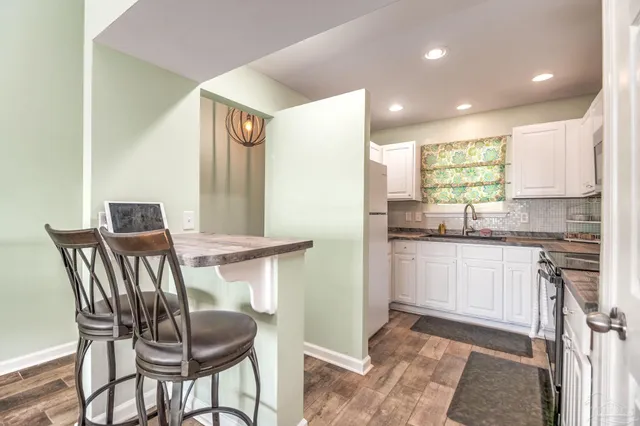 a kitchen that has a cabinets counter space and appliances