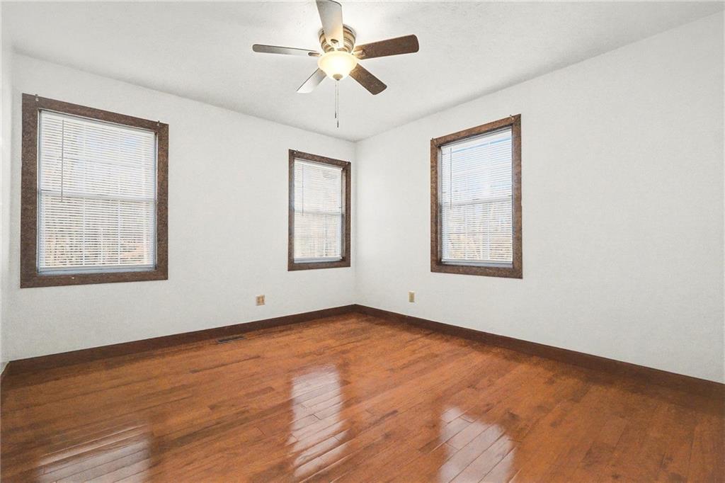 5295 Ridge Road Douglasville, GA 30134 - Photo 13 of 35 an empty room with windows and fan