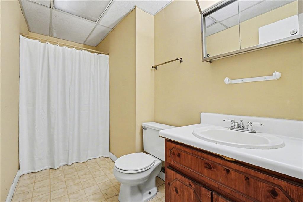 5295 Ridge Road Douglasville, GA 30134 - Photo 23 of 35 a bathroom with a sink a toilet and shower