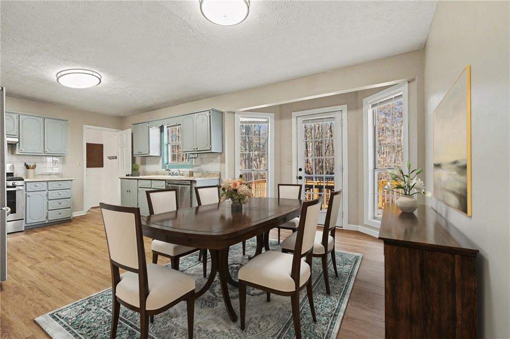 5295 Ridge Road Douglasville, GA 30134 - Photo 3 of 35 a view of a dining room with furniture and wooden floor