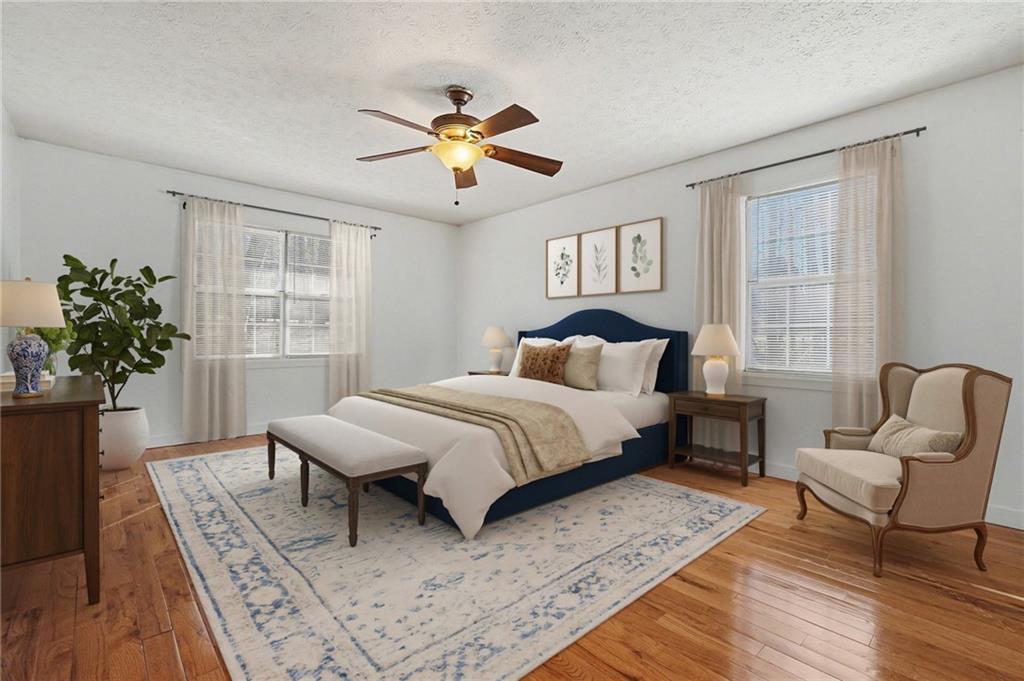 5295 Ridge Road Douglasville, GA 30134 - Photo 4 of 35 a bedroom with a large bed and a couch