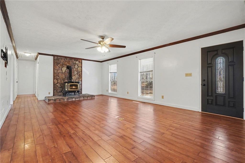 5295 Ridge Road Douglasville, GA 30134 - Photo 8 of 35 a view of empty room with wooden floor and fan
