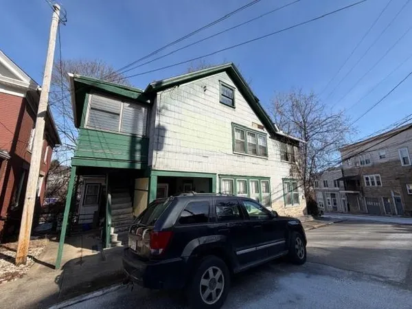 a car parked in front of a house