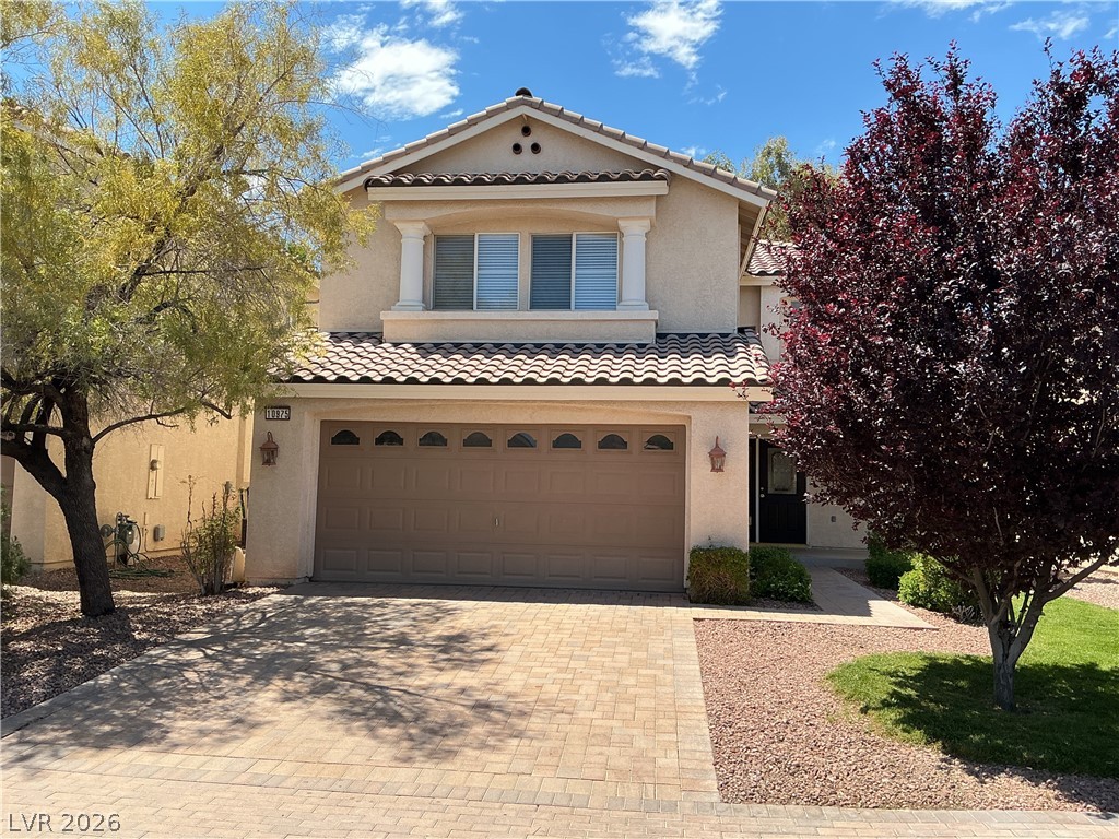 10975 Calcedonian Street Las Vegas, NV 89141 - Photo 1 of 25 This residence showcases a classic exterior with a tiled roof and inviting curb appeal.