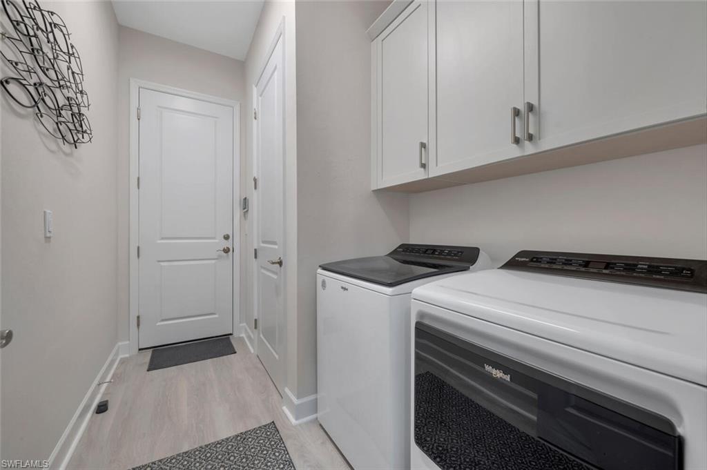7239 Saona Court Naples, FL 34113 - Photo 10 of 12 a utility room with dryer and washer