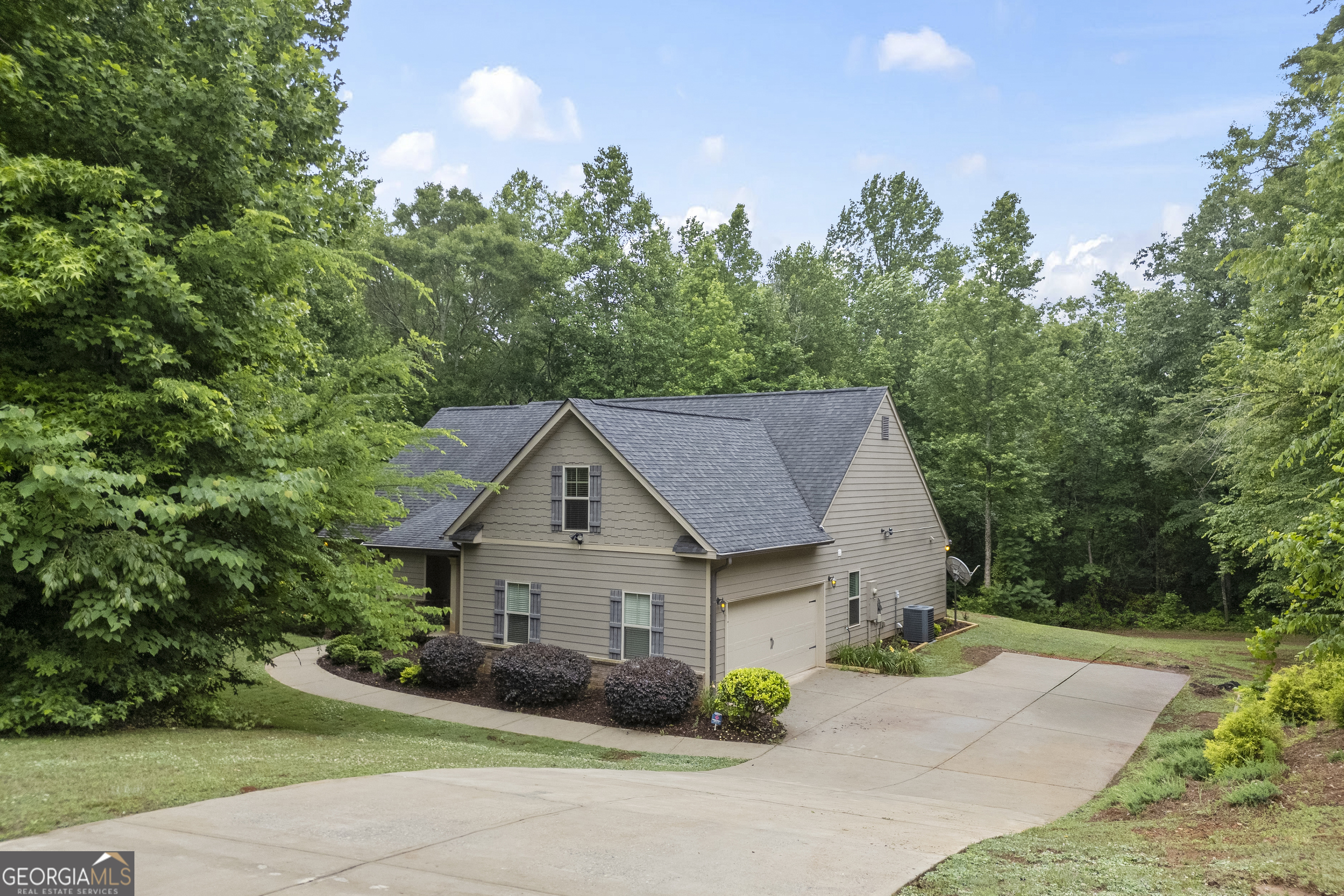 717 Oconee Lane Commerce, GA 30529 - Photo 5 of 57 a view of house with yard and green space