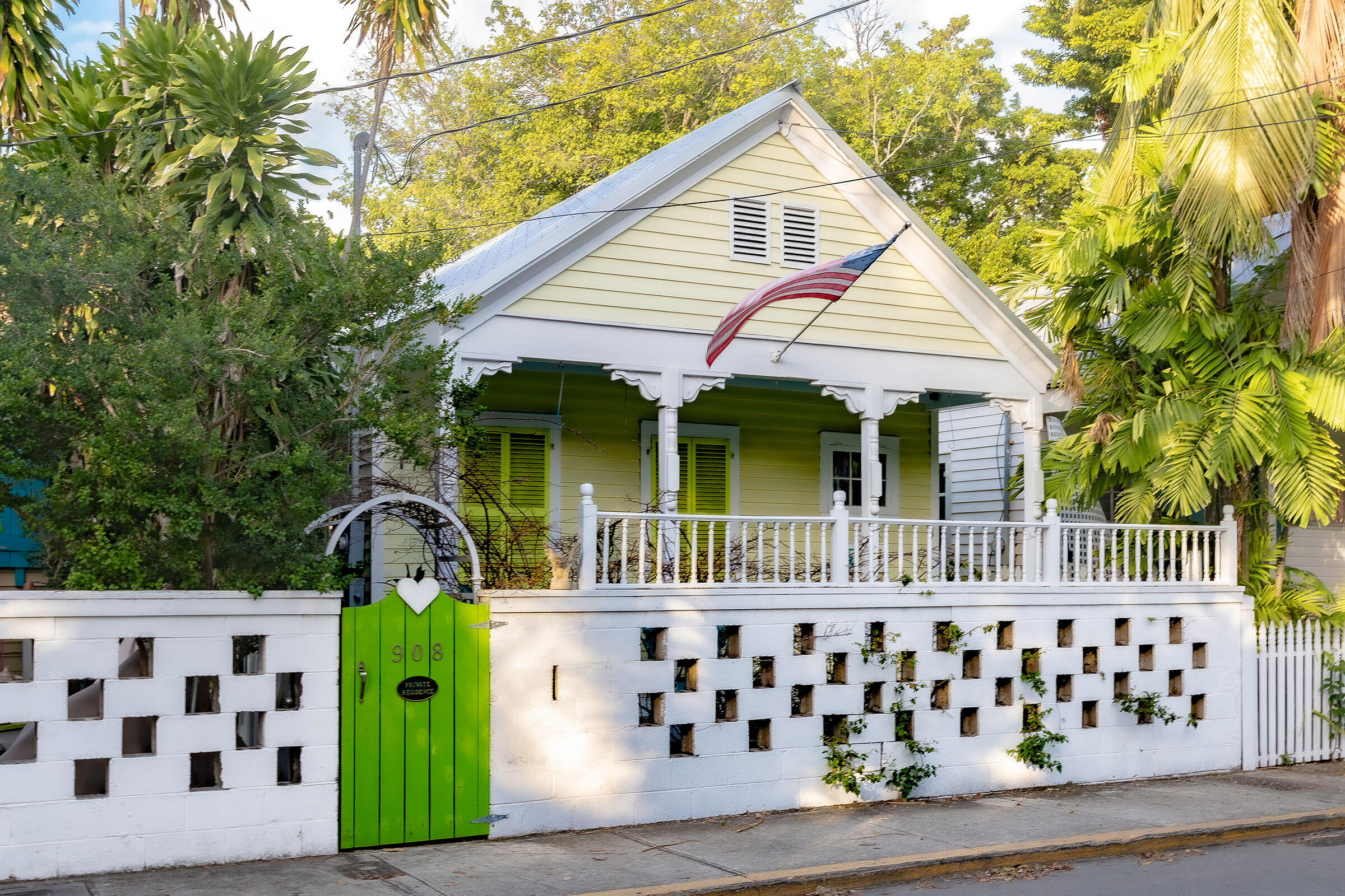908 Windsor Lane Key West, FL 33040 - Photo 1 of 3 a front view of a house with garden