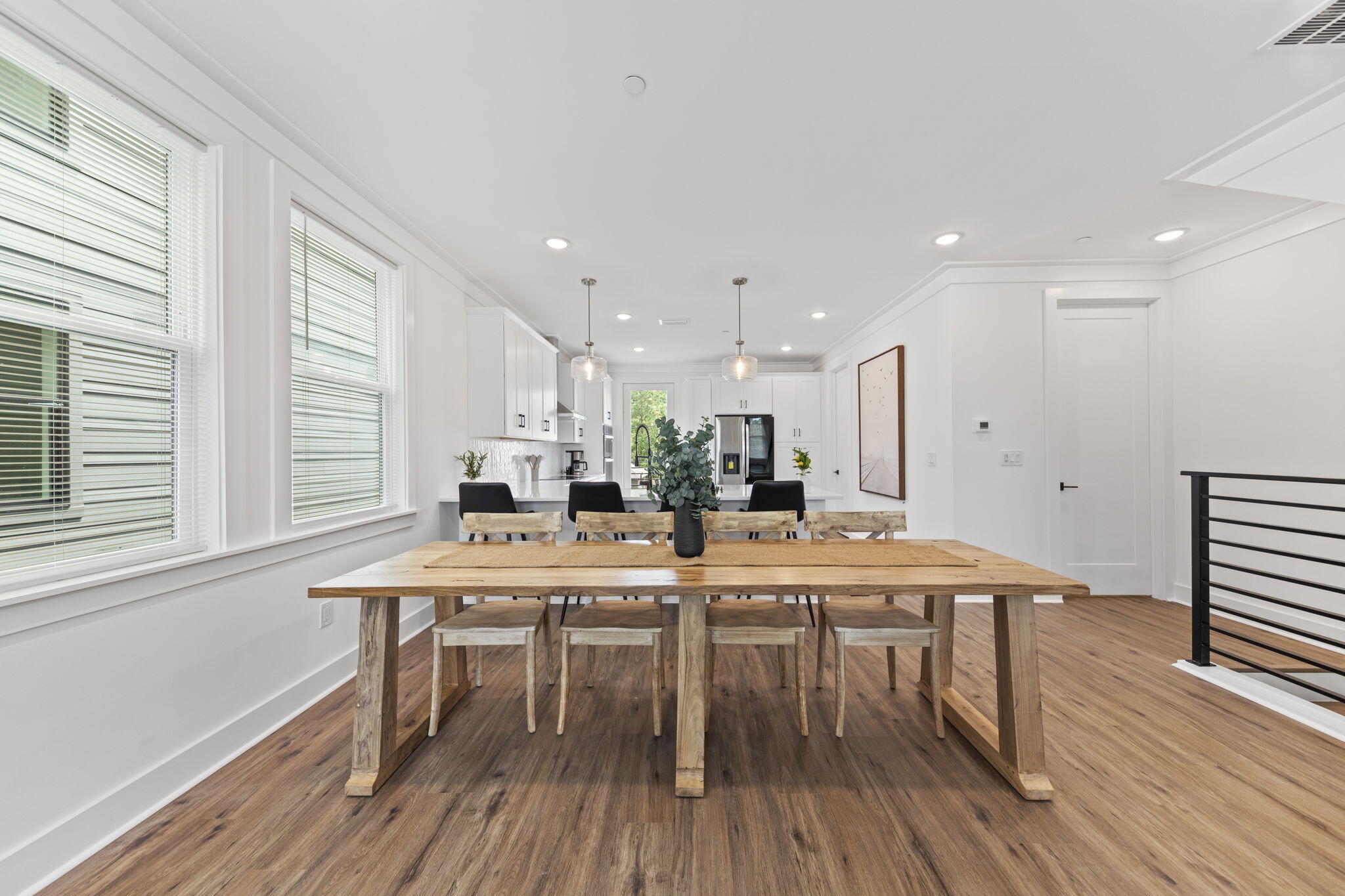 50 Blue Eden Loop, Unit LOT 39 Santa Rosa Beach, FL 32459 - Photo 11 of 46 a kitchen with stainless steel appliances a dining table chairs and wooden floor