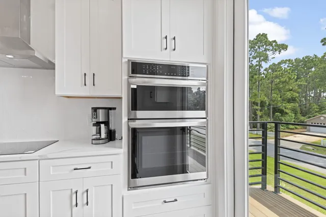a kitchen with cabinets and stainless steel appliances