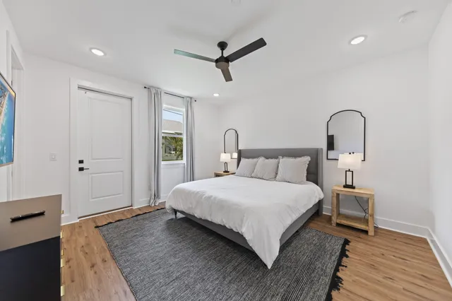 a bedroom with a bed and a dresser