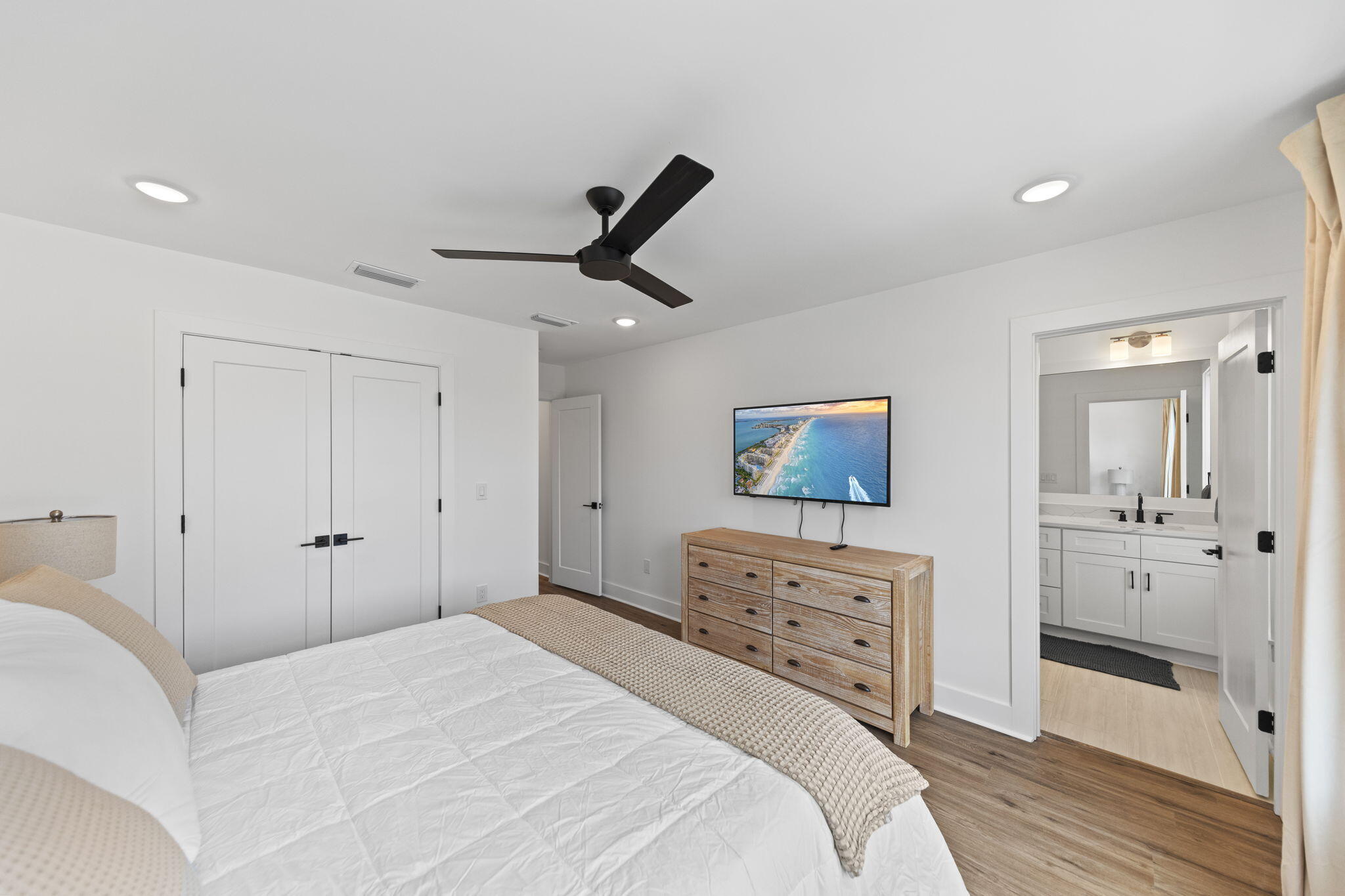 50 Blue Eden Loop, Unit LOT 39 Santa Rosa Beach, FL 32459 - Photo 25 of 46 a bedroom with a bed and a painting on the wall