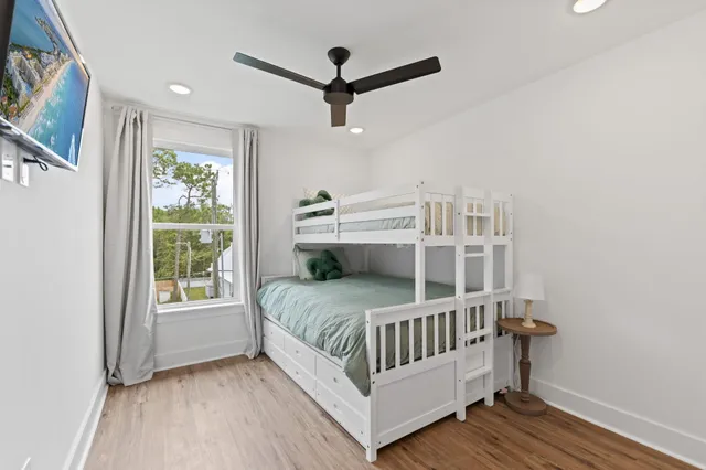 a en suite bathroom with 2 sink tub and a window
