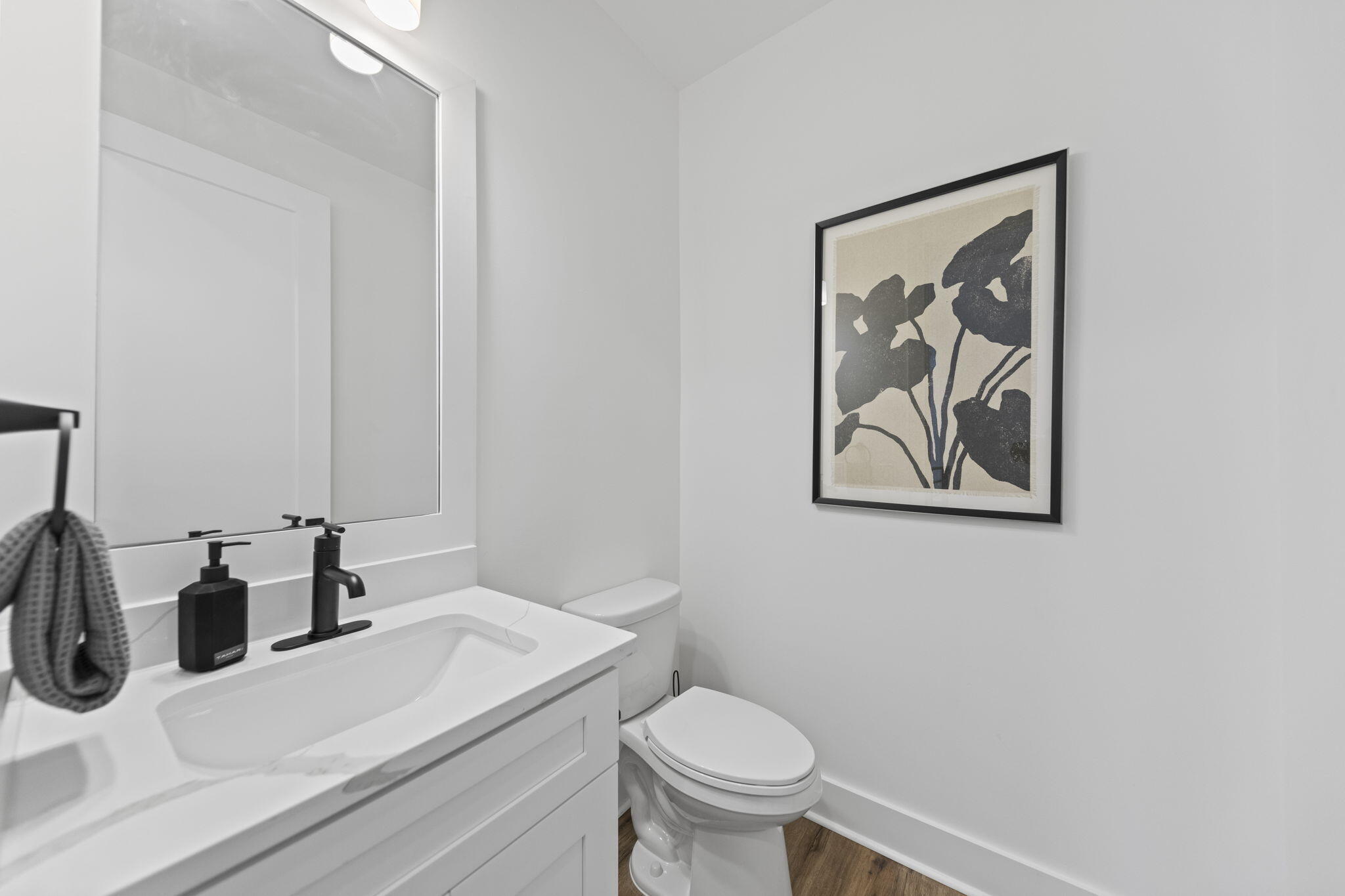 50 Blue Eden Loop, Unit LOT 39 Santa Rosa Beach, FL 32459 - Photo 34 of 46 a bathroom with a toilet a sink and mirror