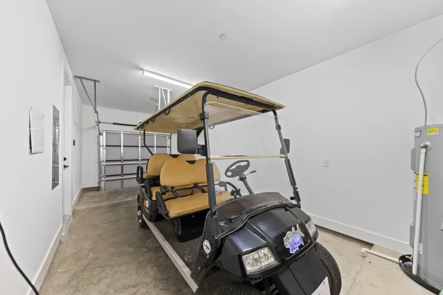 a view of a hallway with wooden floor and stairs