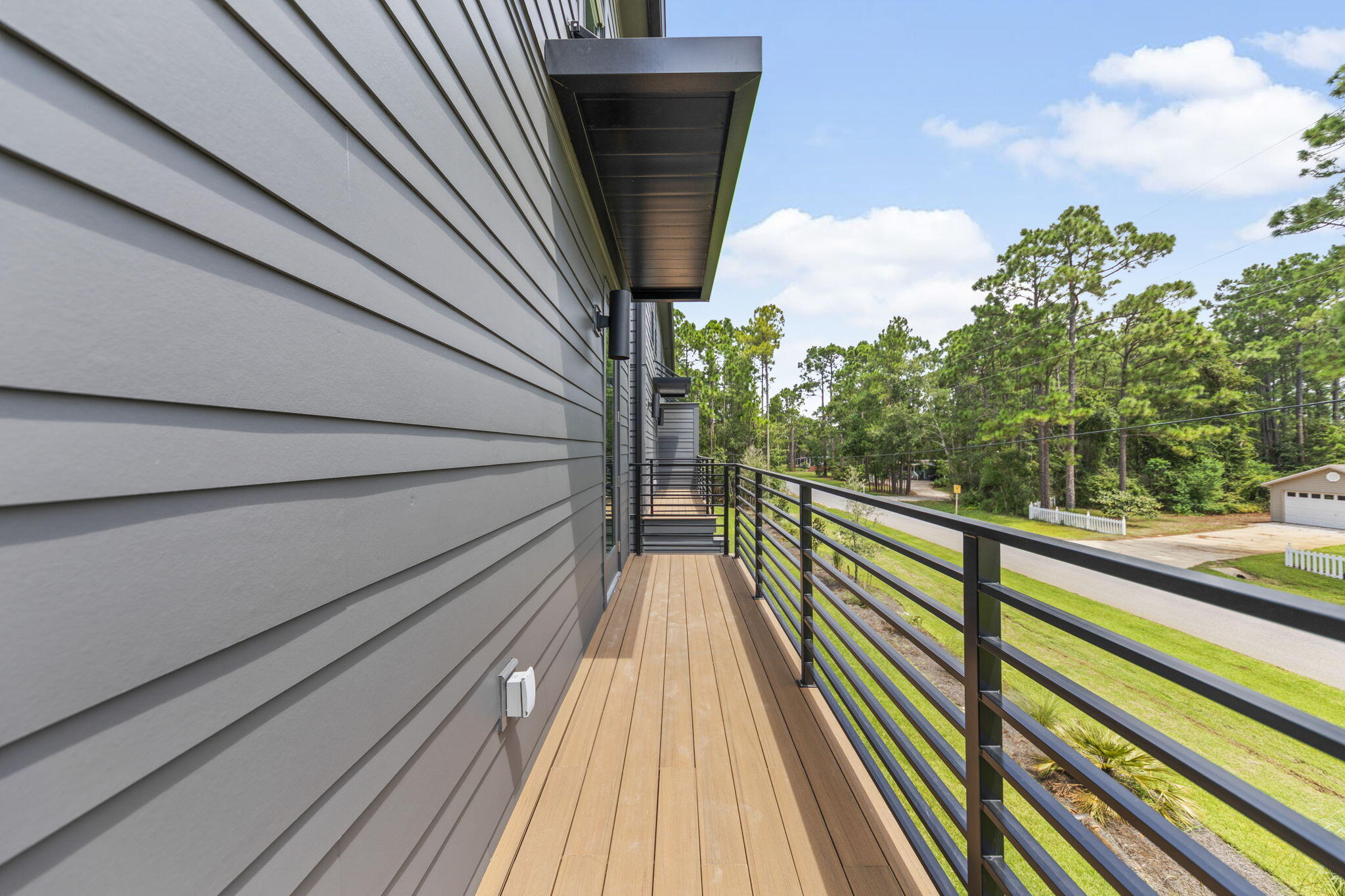 50 Blue Eden Loop, Unit LOT 39 Santa Rosa Beach, FL 32459 - Photo 40 of 46 a view of balcony with wooden floor and fence