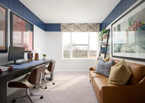 a work room with furniture and a large window