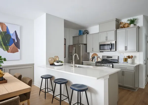 a kitchen with stainless steel appliances a sink and cabinets